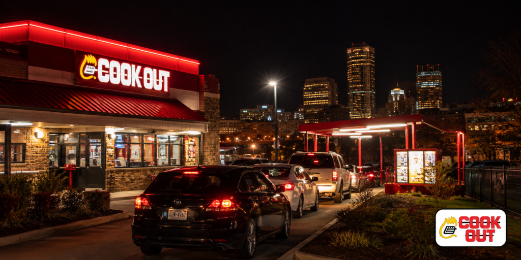 Cook Out restaurant exterior at night in Richmond Virginia with red and white signage and drive-thru lane