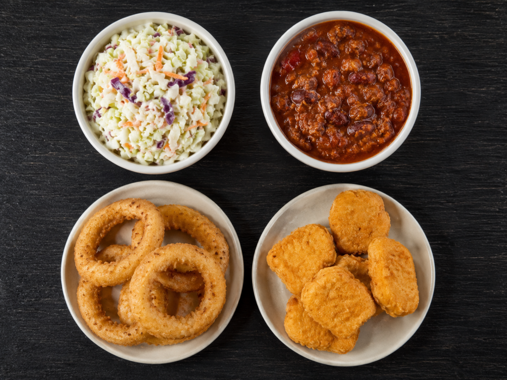 Coleslaw, chili, onion rings, and chicken nuggets shown side by side for comparison